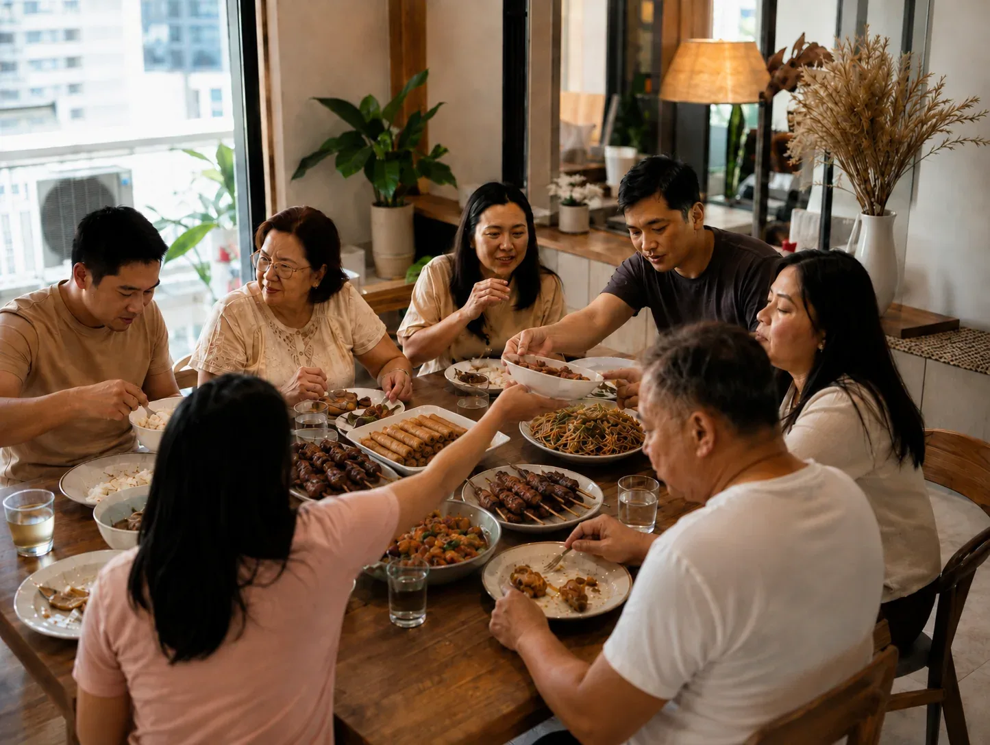 Intimate Filipino family sharing a Mother’s Day meal in a home dining area
